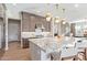 Eat-in kitchen includes stainless appliances, a large island, and pendant lighting at 11656 N San Clemente St, Surprise, AZ 85388