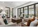 Bright living area with a large windows, fireplace and comfortable seating at 11656 N San Clemente St, Surprise, AZ 85388