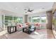 Bright and airy living room featuring a comfortable sectional sofa, large windows, and sliding glass doors for seamless indoor-outdoor living at 11656 N San Clemente St, Surprise, AZ 85388