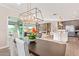 Open floor plan features a spacious living area, dining space, and gourmet kitchen at 11656 N San Clemente St, Surprise, AZ 85388