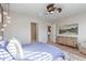 Comfortable main bedroom features contemporary decor, wood floors, and ensuite bath access at 11656 N San Clemente St, Surprise, AZ 85388