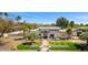 Expansive property featuring manicured landscaping, a circular driveway, and a charming home exterior at 12633 N 81St St, Scottsdale, AZ 85260