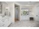 Bright primary bathroom with double vanity sinks, marble countertops, and luxury fixtures at 12633 N 81St St, Scottsdale, AZ 85260
