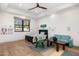 Bright, inviting bedroom with wood floors, ceiling fan, and a fun, colorful accent wall at 12633 N 81St St, Scottsdale, AZ 85260