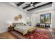 Spacious primary bedroom with beamed ceiling, accent rug, and natural light at 12633 N 81St St, Scottsdale, AZ 85260
