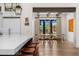 Bright dining area with wooden floors, beamed ceilings, and large windows overlooking the outdoor space at 12633 N 81St St, Scottsdale, AZ 85260
