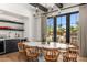 Dining room featuring bar with a marble countertop and large window showcasing backyard at 12633 N 81St St, Scottsdale, AZ 85260