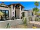 Charming home exterior with well-maintained landscaping and inviting curb appeal at 12633 N 81St St, Scottsdale, AZ 85260