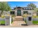 Stunning home exterior with brick walkway, manicured lawn, and stone accents at 12633 N 81St St, Scottsdale, AZ 85260