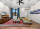 Open-concept living room boasts a colorful sofa, large windows, and hardwood floors at 12633 N 81St St, Scottsdale, AZ 85260