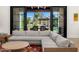 Living room showcasing sliding glass doors to an outdoor kitchen and covered patio at 12633 N 81St St, Scottsdale, AZ 85260