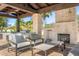 Covered outdoor area with a fireplace and grill; perfect for entertaining at 12633 N 81St St, Scottsdale, AZ 85260