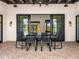 Covered patio has outdoor dining area and brick flooring, perfect for entertaining at 12633 N 81St St, Scottsdale, AZ 85260