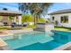 Gorgeous backyard with a pool, spa, outdoor fireplace, lounging area and mature trees at 12633 N 81St St, Scottsdale, AZ 85260