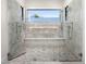 Elegant walk-in shower featuring marble tile and dual shower heads at 12633 N 81St St, Scottsdale, AZ 85260