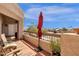 Outdoor balcony features seating, greenery and a view of mature trees at 14645 N Fountain Hills Blvd # 208, Fountain Hills, AZ 85268
