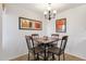 Cozy dining room with modern chandelier and wood table set at 14645 N Fountain Hills Blvd # 208, Fountain Hills, AZ 85268
