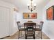 Cozy dining room with modern chandelier and wood table set at 14645 N Fountain Hills Blvd # 208, Fountain Hills, AZ 85268