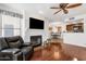 Open-concept living space with fireplace flowing into kitchen and dining area at 14645 N Fountain Hills Blvd # 208, Fountain Hills, AZ 85268