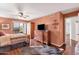Bedroom with wood floors, ceiling fan, and large TV on dresser at 14645 N Fountain Hills Blvd # 208, Fountain Hills, AZ 85268