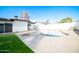 Backyard featuring a refreshing pool and a well-maintained lawn, perfect for outdoor relaxation at 1633 E Wesleyan E Dr, Tempe, AZ 85282