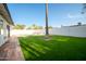 This home features a large, private backyard and new synthetic grass at 1633 E Wesleyan E Dr, Tempe, AZ 85282