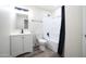 Well-lit bathroom features modern vanity, toilet, and bathtub with black hardware at 1633 E Wesleyan E Dr, Tempe, AZ 85282