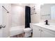 Bright bathroom features white tile, black hardware, and modern finishes at 1633 E Wesleyan E Dr, Tempe, AZ 85282