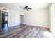 This bedroom offers modern ceiling fan, wood floors, and sliding closet doors at 1633 E Wesleyan E Dr, Tempe, AZ 85282