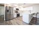 Bright kitchen features stainless steel appliances, sleek white cabinets, and modern countertops at 1633 E Wesleyan E Dr, Tempe, AZ 85282