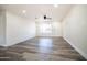 Inviting living room featuring wood-look floors and a bright interior, creating a comfortable atmosphere at 1633 E Wesleyan E Dr, Tempe, AZ 85282