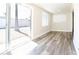 Bright sun room with sliding glass doors and a large window fills the room with natural light at 1633 E Wesleyan E Dr, Tempe, AZ 85282