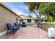 Spacious backyard featuring a brick patio, black railing, and comfortable seating, great for outdoor enjoyment at 17822 N Del Webb Blvd, Sun City, AZ 85373