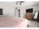 Bedroom featuring a closet, a flat screen TV, and a light color scheme at 17822 N Del Webb Blvd, Sun City, AZ 85373