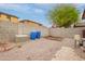 Enclosed backyard with blue barrels, perfect for creating a private outdoor sanctuary at 18374 W Stinson Dr, Surprise, AZ 85374