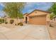 Attractive single-level home with drought-tolerant landscaping, a two-car garage, and neutral tones at 18374 W Stinson Dr, Surprise, AZ 85374