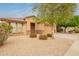 Charming single-story home with well-maintained landscaping and a two-car garage at 18374 W Stinson Dr, Surprise, AZ 85374