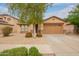 Charming single-story home with desert landscaping, a neutral color palette, and a two-car garage at 18374 W Stinson Dr, Surprise, AZ 85374