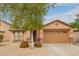 Inviting single-story home with xeriscaping, stone accents, and a spacious two-car garage at 18374 W Stinson Dr, Surprise, AZ 85374