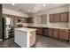 Well-equipped kitchen with an island, stainless steel appliances, and ample cabinet space at 18374 W Stinson Dr, Surprise, AZ 85374
