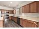 Spacious kitchen featuring stainless steel appliances, wood cabinets, and laminate flooring at 18374 W Stinson Dr, Surprise, AZ 85374