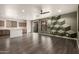 Open-concept living room with a view of the kitchen, dining and natural light at 18374 W Stinson Dr, Surprise, AZ 85374