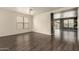 The bright living room boasts open space, access to backyard, and stylish flooring at 18374 W Stinson Dr, Surprise, AZ 85374