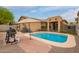 Private backyard pool with ample patio space, ideal for summer gatherings at 18374 W Stinson Dr, Surprise, AZ 85374