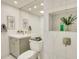 Modern bathroom featuring tile shower with decorative niche and gray vanity at 18607 N 125Th Ave, Sun City West, AZ 85375