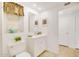 Cozy bathroom with white vanity, decorative mirror, and bright natural light at 18607 N 125Th Ave, Sun City West, AZ 85375