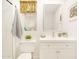 Elegant bathroom featuring white tile, vanity with storage, and decorative accents at 18607 N 125Th Ave, Sun City West, AZ 85375
