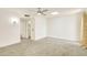 Bedroom with a ceiling fan, a skylight, and a large window, offering ample natural light at 18607 N 125Th Ave, Sun City West, AZ 85375