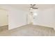 Bedroom with plush carpet, modern ceiling fan, with access to walk-in closet at 18607 N 125Th Ave, Sun City West, AZ 85375