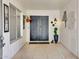 Welcoming entryway featuring double doors, tile flooring, and decorative accents at 18607 N 125Th Ave, Sun City West, AZ 85375